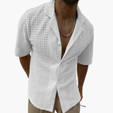 Short-sleeve men's shirt with open collar and textured surface