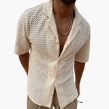 Short-sleeve men's shirt with open collar and textured surface