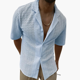 Short-sleeve men's shirt with open collar and textured surface