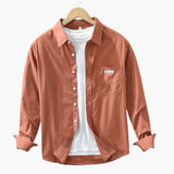 Men's long-sleeve shirt with chest pocket and button closure