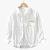 Men's long-sleeve shirt with chest pocket and button closure
